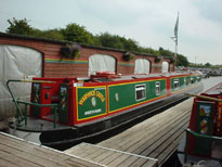 Semi-traditional shaped stern of a narrowboat or canal boat.